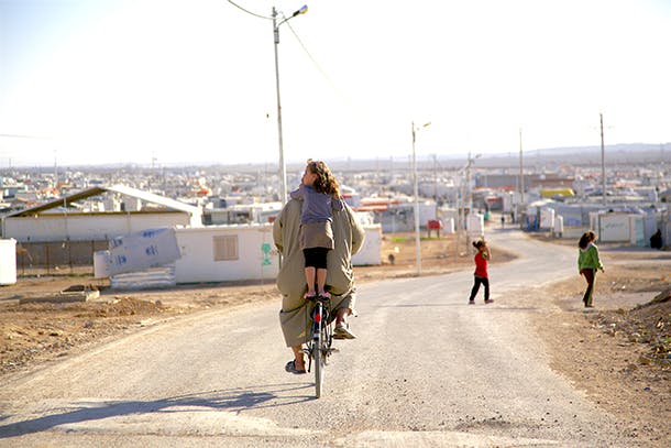 Girl on back of bike