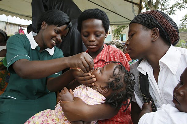 A health worker administers the polio vaccine during Family Health Day; a campaign supported by UNICEF, in Nabingoola, Uganda, Friday, Oct. 26, 2012. (Stuart Ramson/Insider Images for UN Foundation)