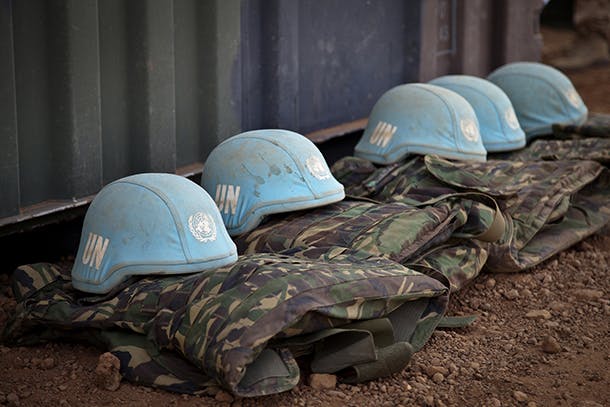 Blue helmets from the Dutch Engineering Company serving with MINUSMA are seen sitting on the ground at the under construction military camp in Gao, Northern Mali. The Dutch Contingent will be effective in the next weeks and will consist in 380 soldiers from Logistic Team, Special Forces and 6 Apache helicopters.