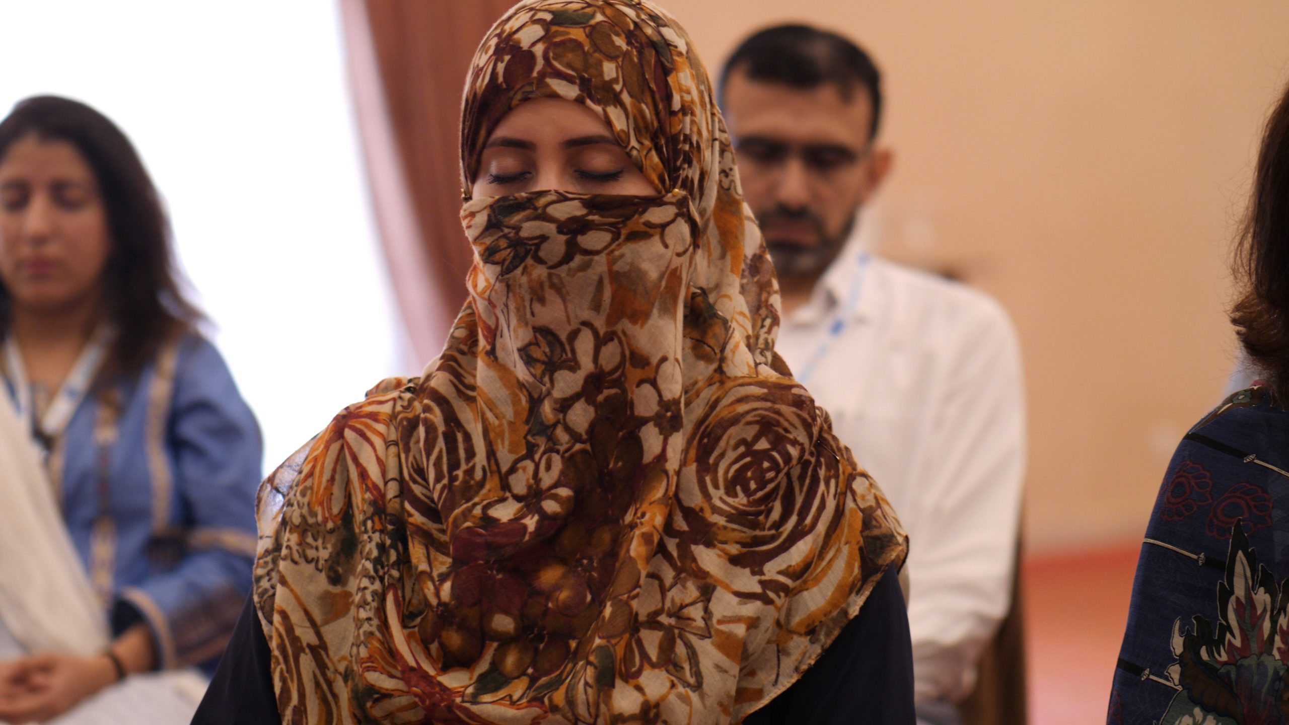 woman closes her eyes during yoga