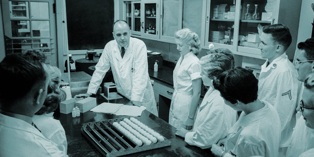 Dr. Maurice Hilleman -- pictured with his research team