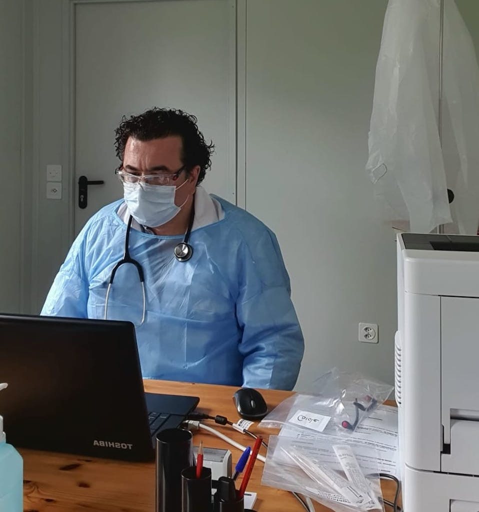 Dr. Konstantinos Petsanis on his laptop