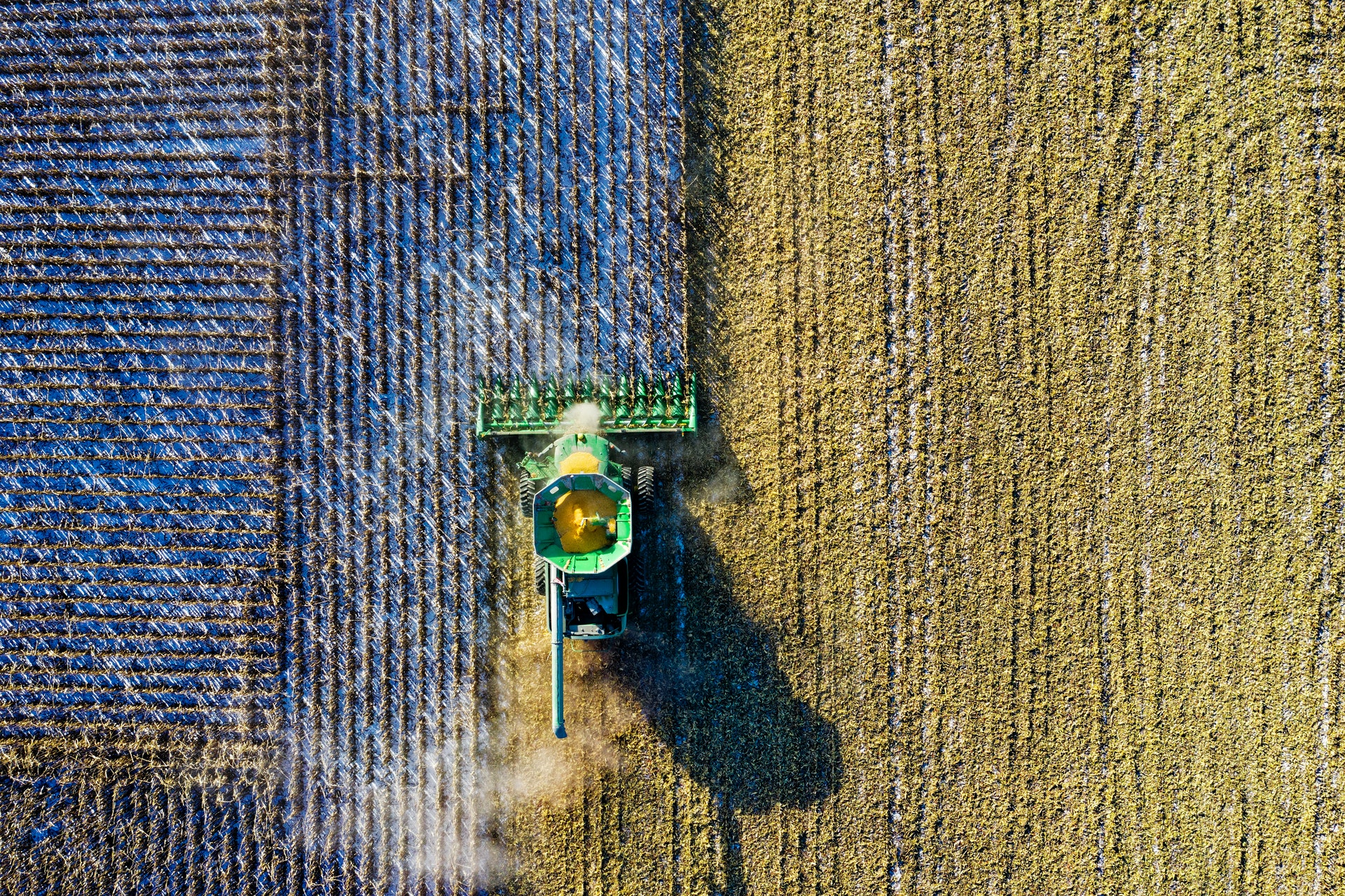 A tractor plows a field.