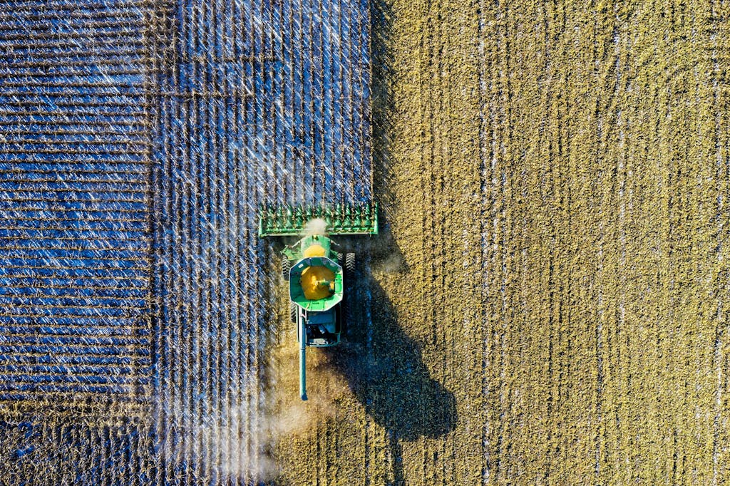 A tractor plows a field.