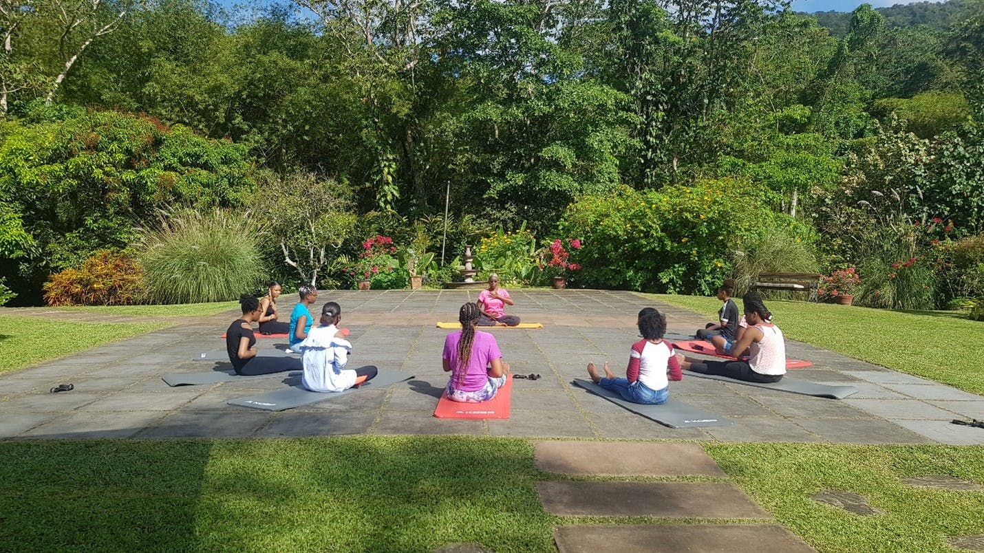 Girls and young women doing yoga as part of the NiNa program.
